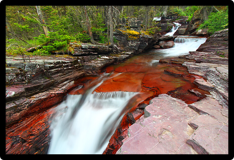 Cascades of a beautiful mountain stream in Glacier National Park in Montana.