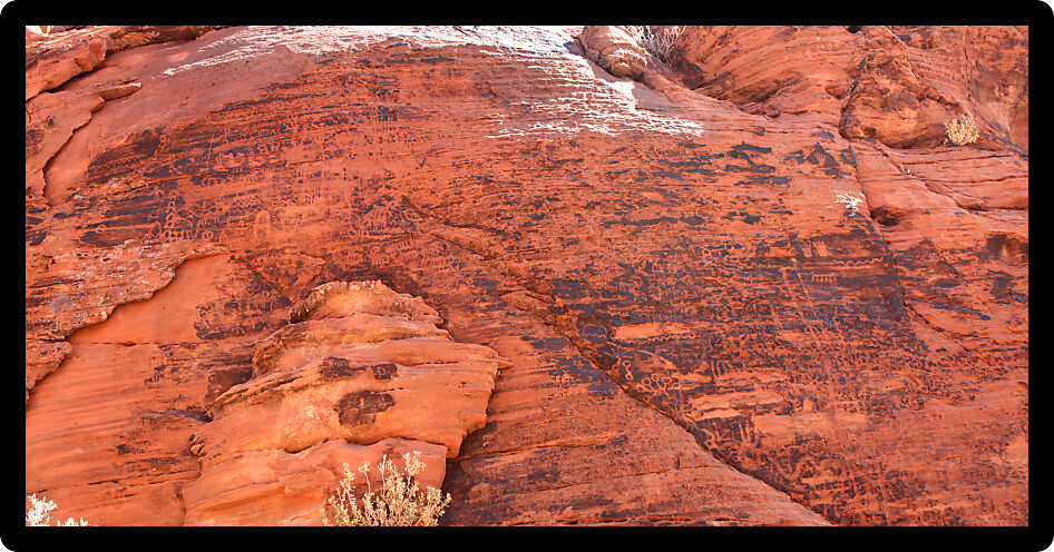 Petroglyphs on a rock wall at Valley of Fire State Park in Nevada.