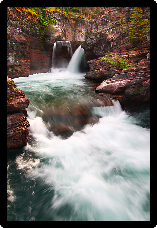 Rushing waters of Saint Mary Falls at Glacier National Park.