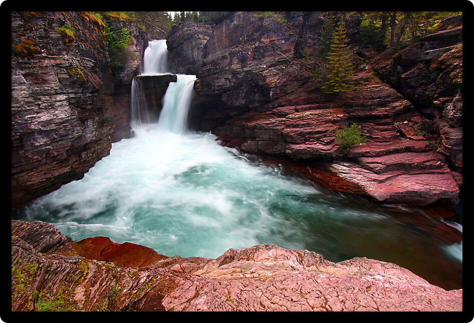 Rushing waters of Saint Mary Falls at Glacier National Park USA.