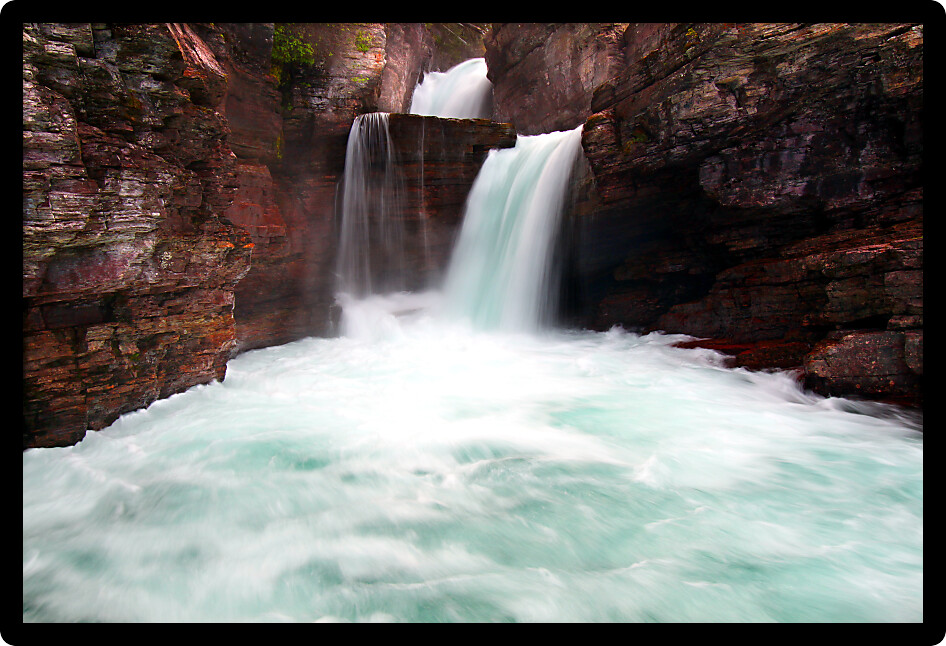 Rushing waters of Saint Mary Falls at Glacier National Park USA.