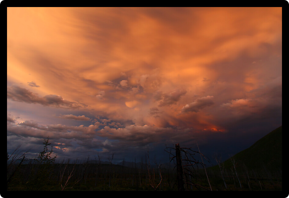 Clouds at twilight create an eerie palette of color in the skies above Glacier National Park.