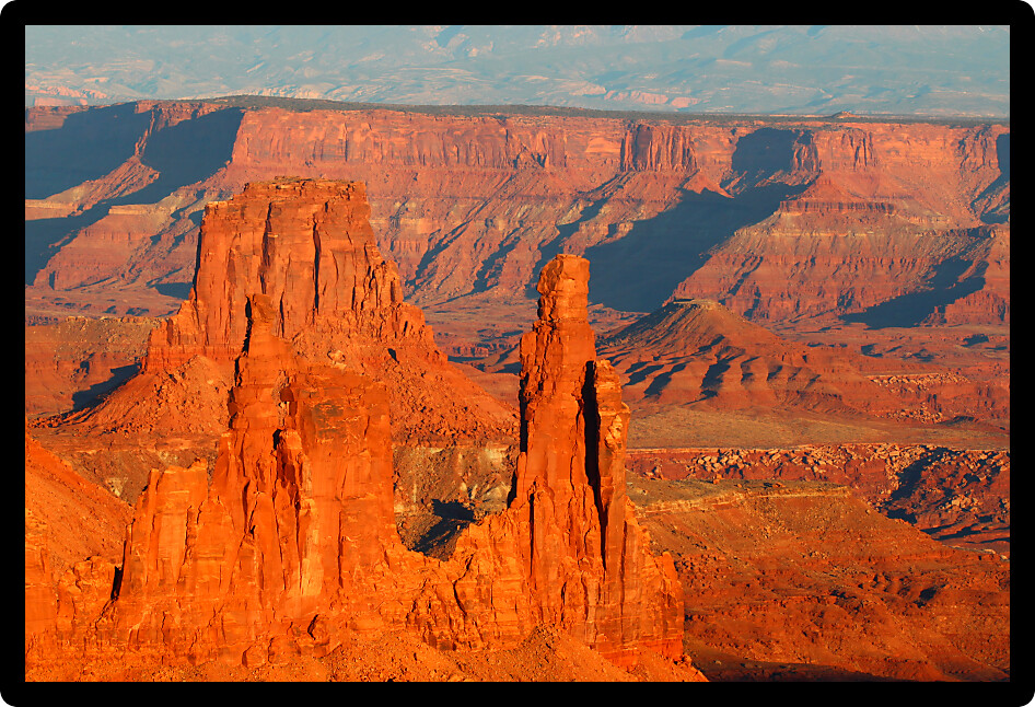 Rugged rock formations adorn the evening landscape of Canyonlands National Park of Utah.