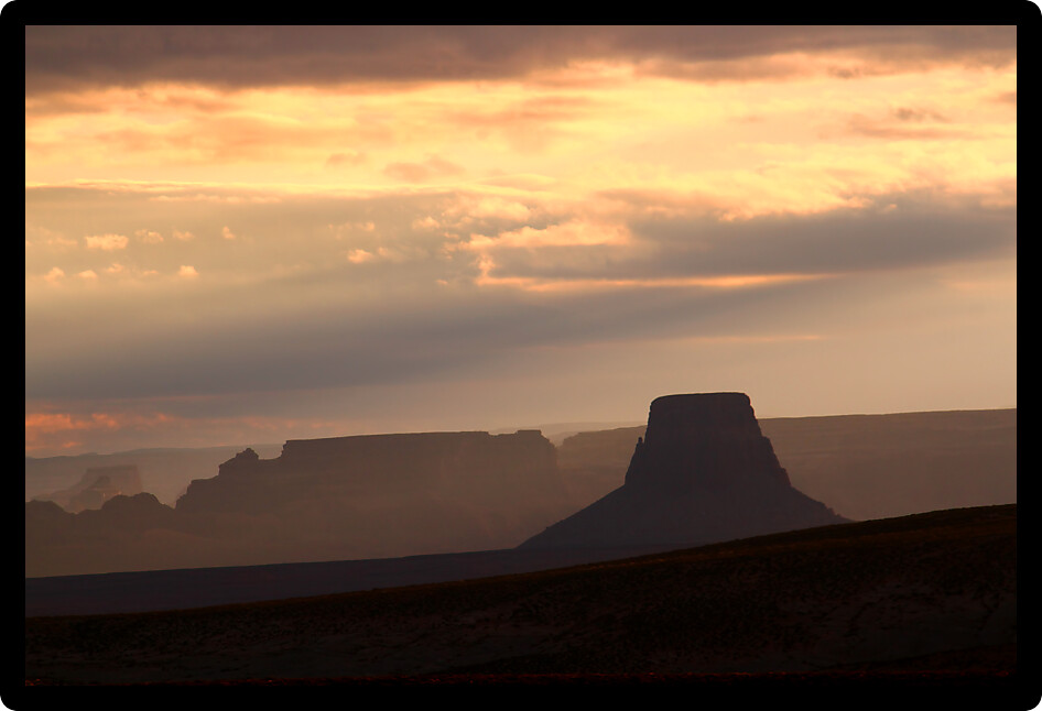 Striking rock formations glazed by morning sunlight at the Glen Canyon National Recreation Area.