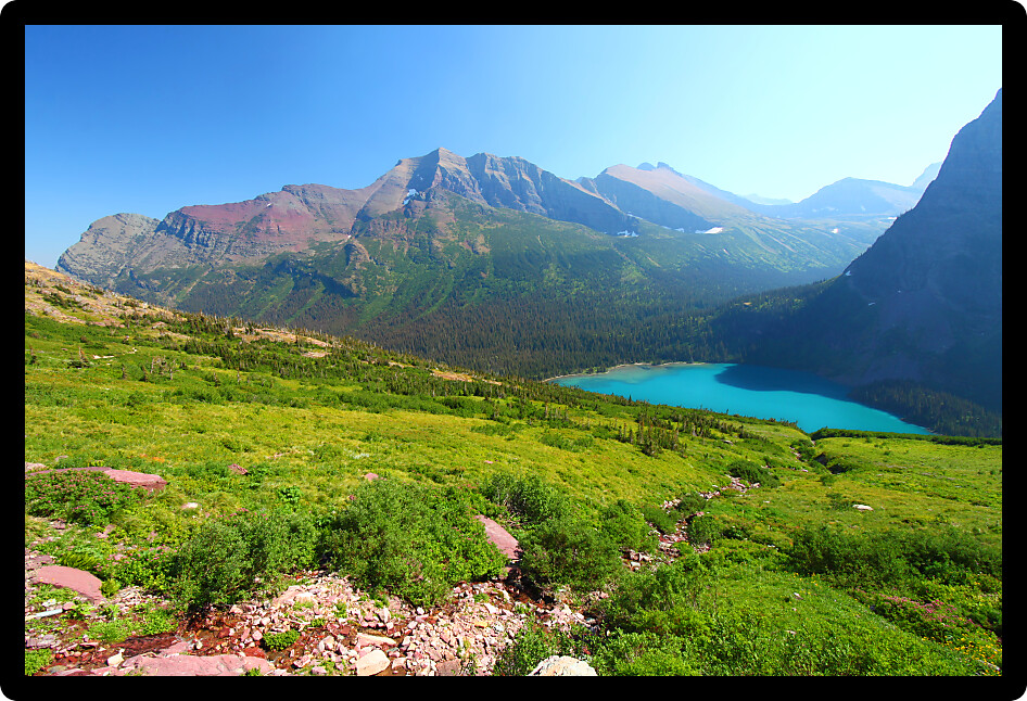Turquoise waters of Grinnell Lake amidst the majestic alpine scenery of Glacier National Park.