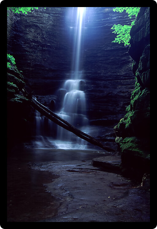 Sunlight illuminates the brink of Lake Falls at Matthiessen State Park in central Illinois.