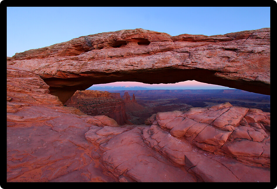 Mesa Arch of Canyonlands National Park on a calm evening.