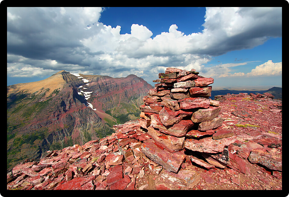 Rock cairn marking the summit of Mount Sinopah in Glacier National Park of Montana.