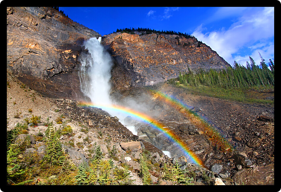 Double rainbows in the mist below Takakkaw Falls of Yoho National Park in Canada.