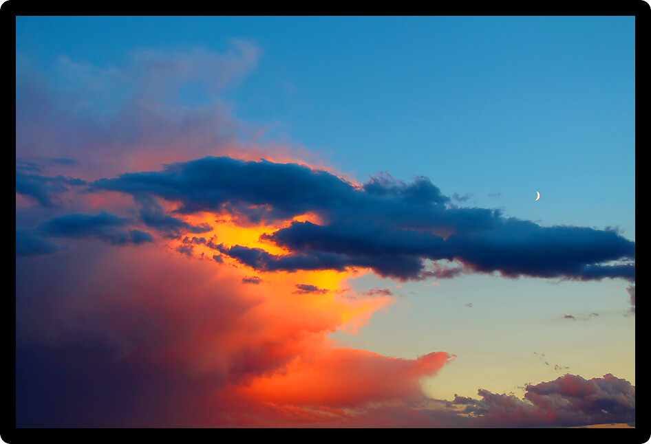 Evening light falls on a summer thunderstorm in the Midwest United States.