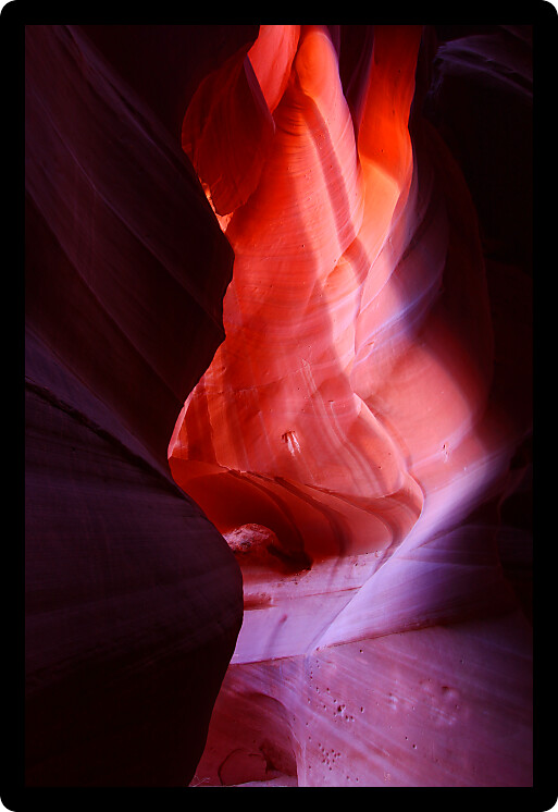 Patches of light illuminate the beautifully colored rock walls of Antelope Canyon in Arizona.