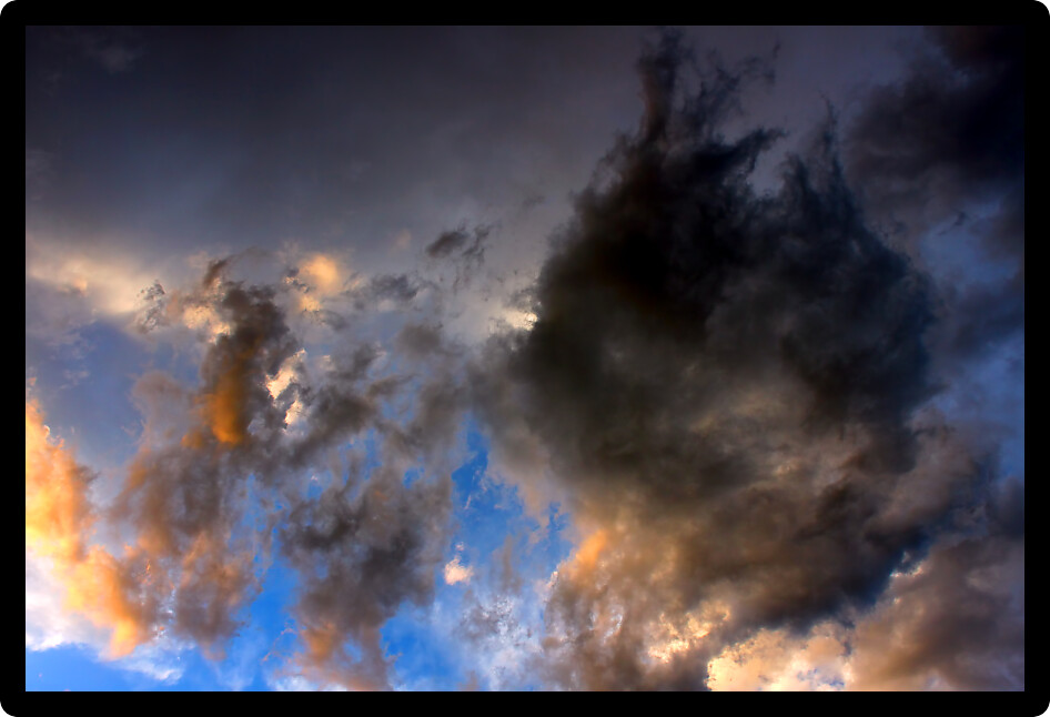 Last sunlight falls on evening clouds in the Midwest United States.