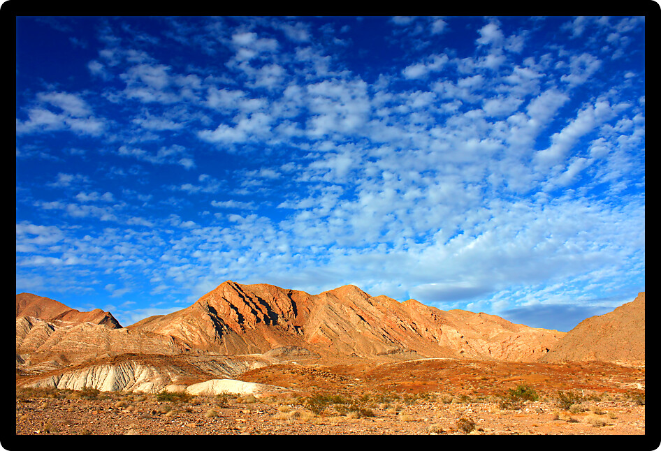 Clouds form an intricate pattern over the desert landscape of Lake Mead National Recreation Area in Nevada.