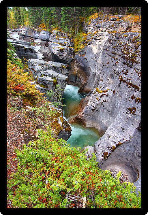 Water crashes through Maligne Canyon of Jasper National Park in Canada.
