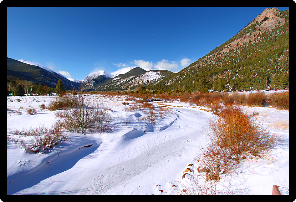 Fall River frozen over on a winter day in Rocky Mountain National Park of Colorado.