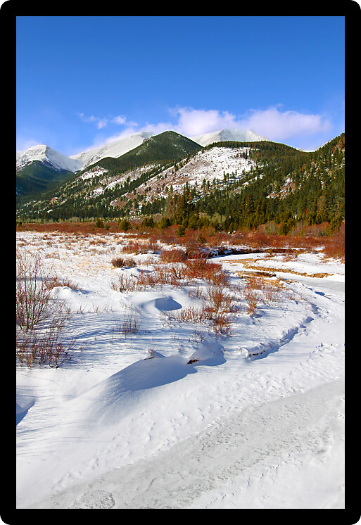 Fall River frozen over on a winter day in Rocky Mountain National Park of Colorado.