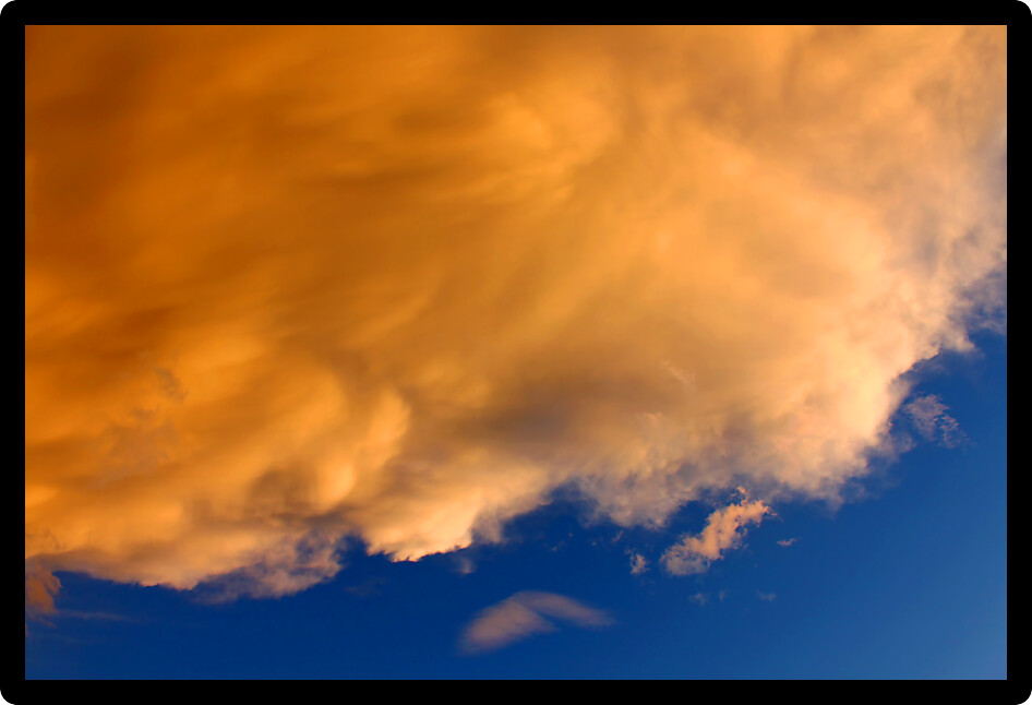 Bright sunlit clouds over deep blue skies over northern Montana.